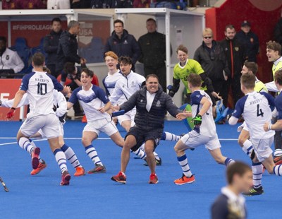 The team rush to celebrate with Head of Hockey at Reed